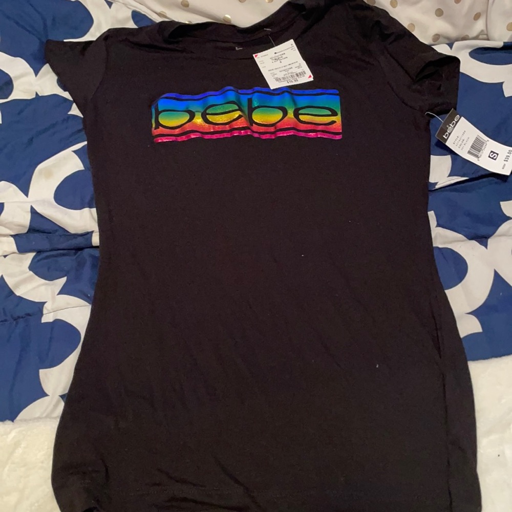 A bebe black shirt with rainbow like print